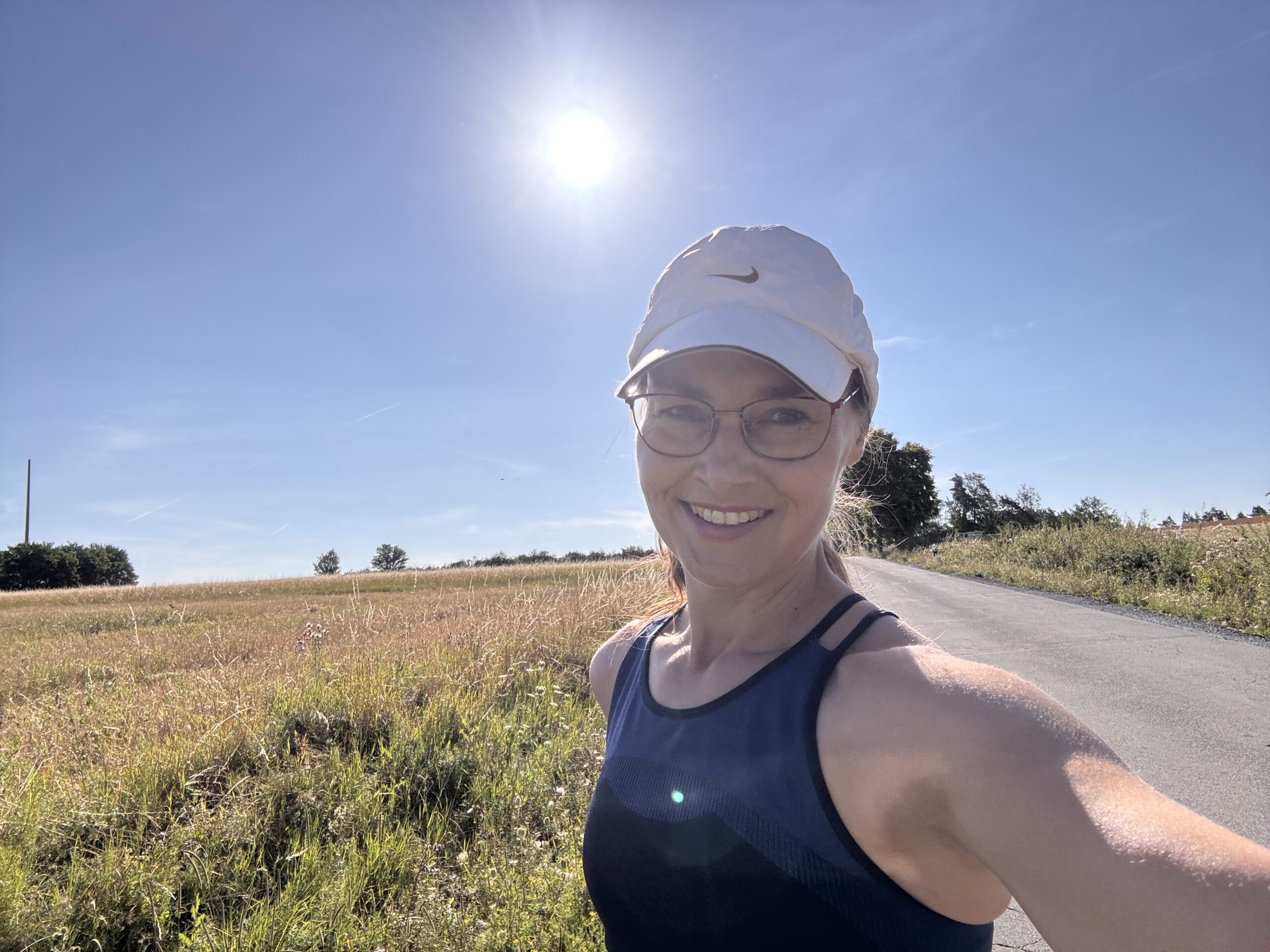 Claudia Garbutt running in the countryside